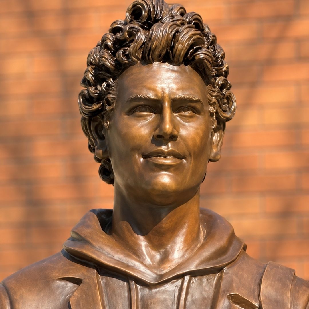 Close-up of the Carlo Acutis bronze statue at St. Ignatius Parish School in Mobile Alabama.