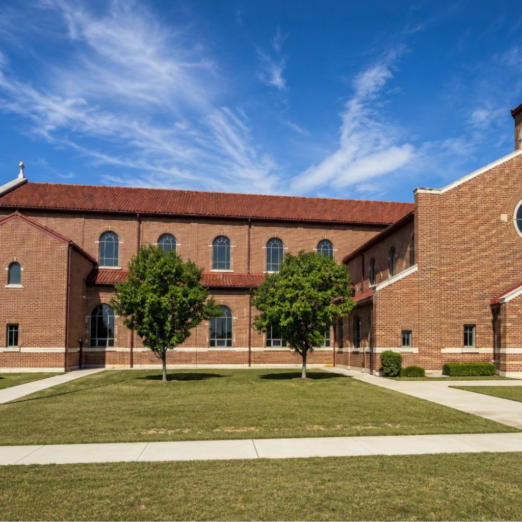 Open church courtyard showing a potential location for a future Catholic prayer garden