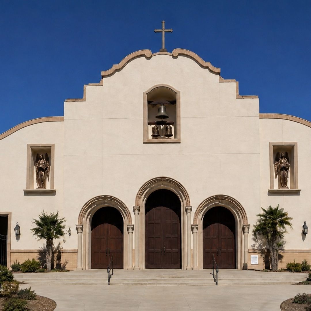 Entrance Angels with Latin scrolls above the entrance of St. Charles Borromeo Catholic Church